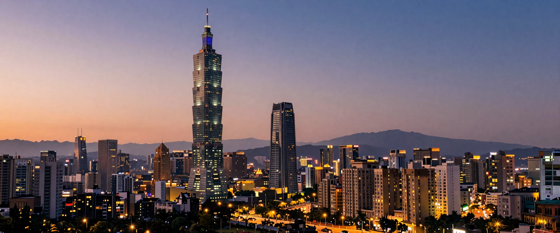 Taipei 101 skyline at twilight with warm city lights and misty mountains in background showcasing modern Taiwan